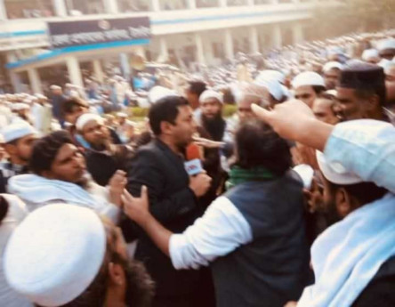 Journo attacked during live broadcast after referring to protesters as "Pro-Zubair"