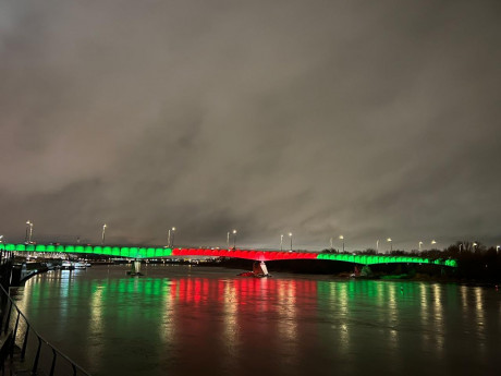 Polish bridge lit up in red, green commemorating Bangladesh Victory Day