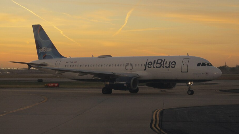 Passenger opens plane exit door at Boston airport after 'argument with girlfriend', sparks panic