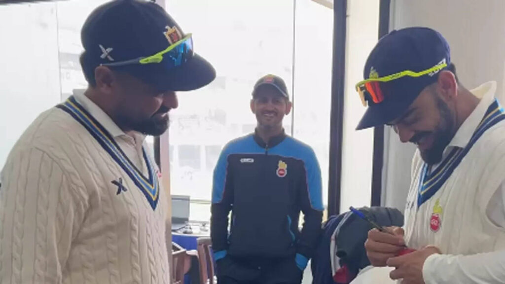 Sangwan's fan moment, takes Kohli's autograph after dismissing him