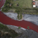 'It looks like a stream of blood.' A river near Buenos Aires turns red, sparking fears of toxic leak