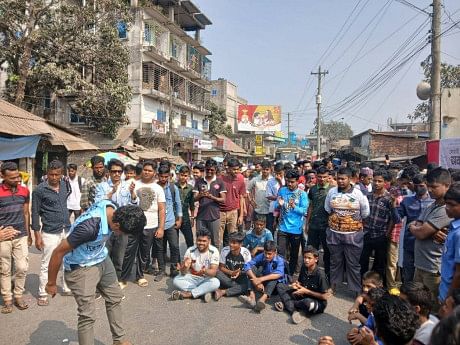 Students block road demanding dredging on Sowai in Netrokona